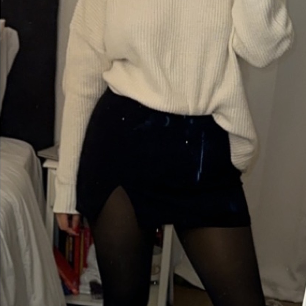 White Sweater and Black Skirt